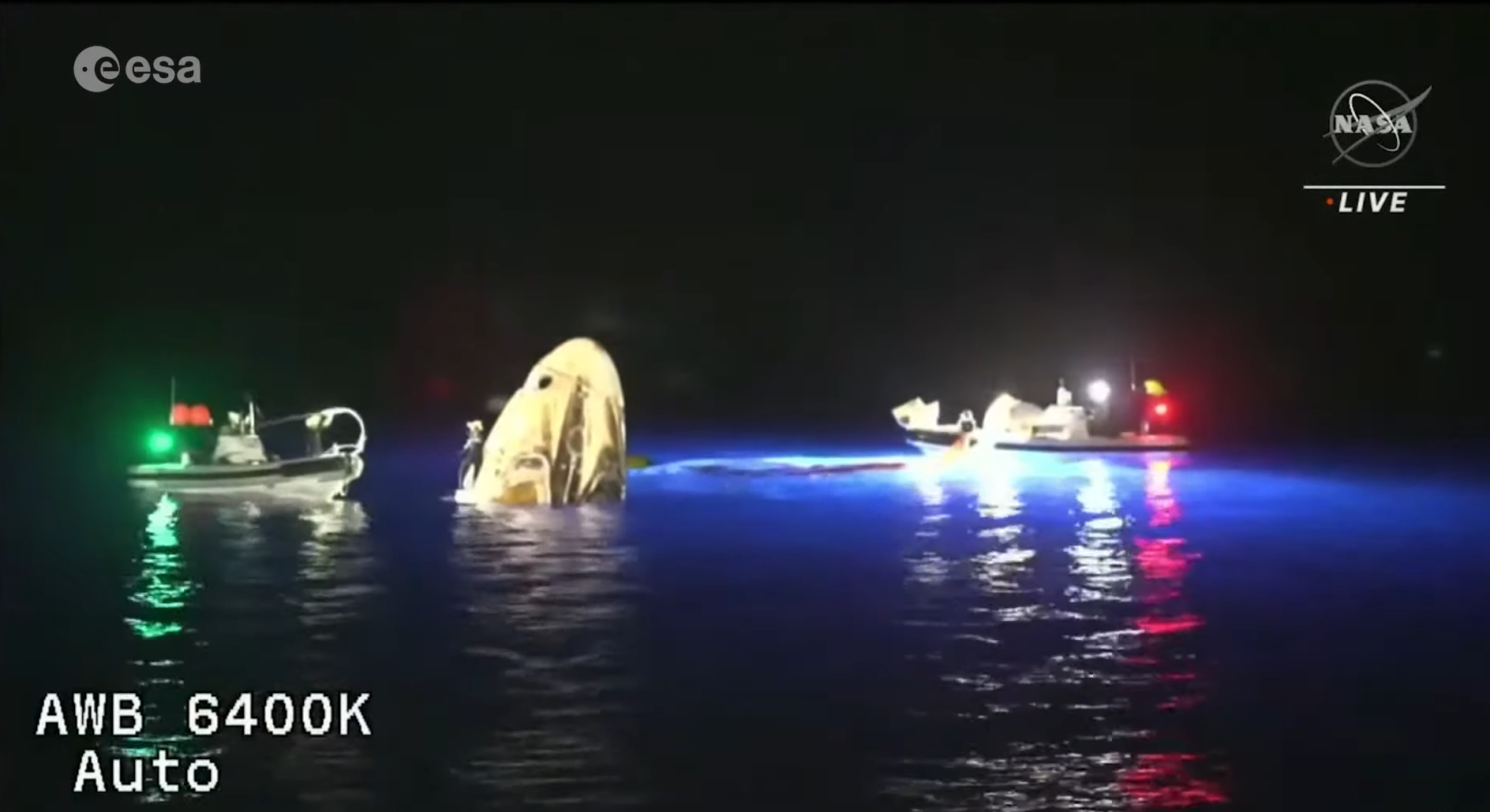 Space capsule splashing into water
