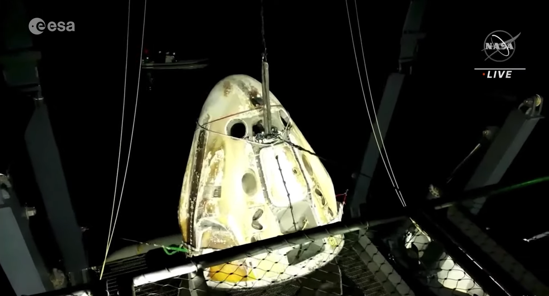 Space capsule splashing into water