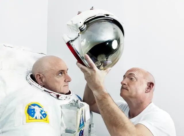 On the left is Scott, who has lived on the International Space Station for a year; on the right is his twin brother Mark, who is in control on Earth