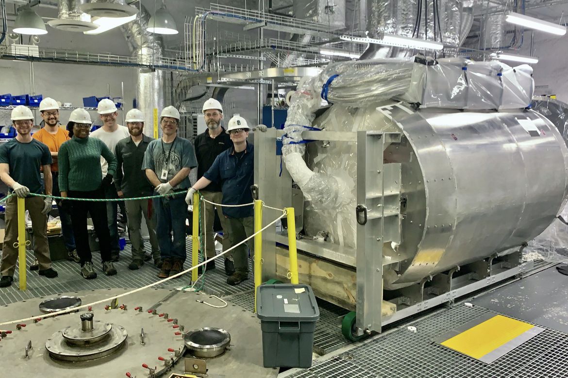 Workers with the LUX-ZEPLIN central detector after transporting it underground to the Sanford Underground Research Laboratory.
