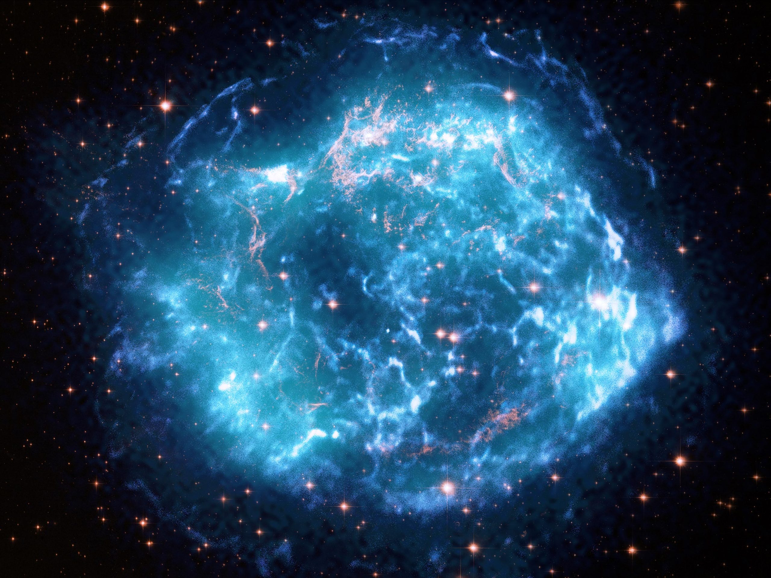 The image is a combination of observations from the Chandra X-ray Observatory, the Hubble Space Telescope, and the Imaging X-ray Polarimetry Explorer ( IXPE ) satellite, which shows the magnetic field distribution of the stellar remnant.