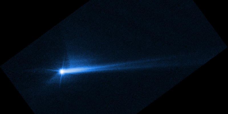 This image taken by Hubble shows debris erupting from the surface of the Dimorphos